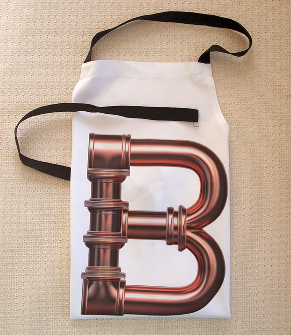 PIPES LETTER B APRON