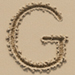 Sand type letter G
