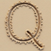 Sand type letter Q