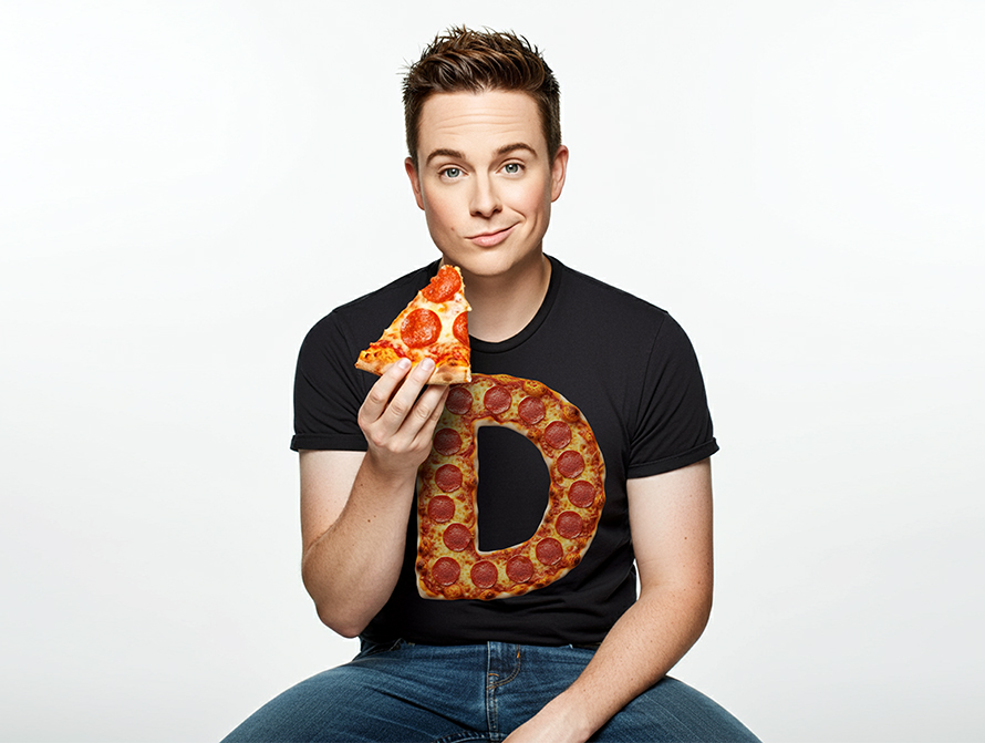 Buy eating a slice of pizza and wearing a Pizza letter t-shirt